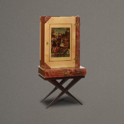 Aldo Tura. Cantina a manera de libro en madera y pergamino con interiores de espejo y charola superior.